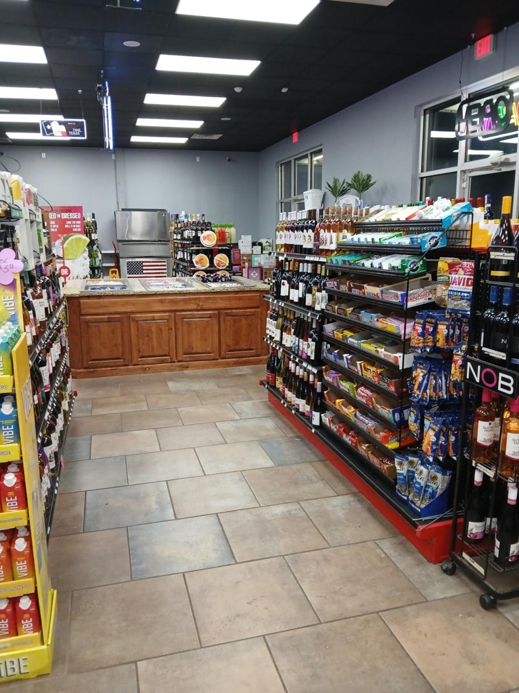 Express 64 snack aisles and wine selection with organized displays and competitive prices